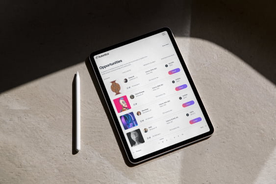 An iPad displaying the Autentica Marketplace Investment Opportunities feature as it's being used.